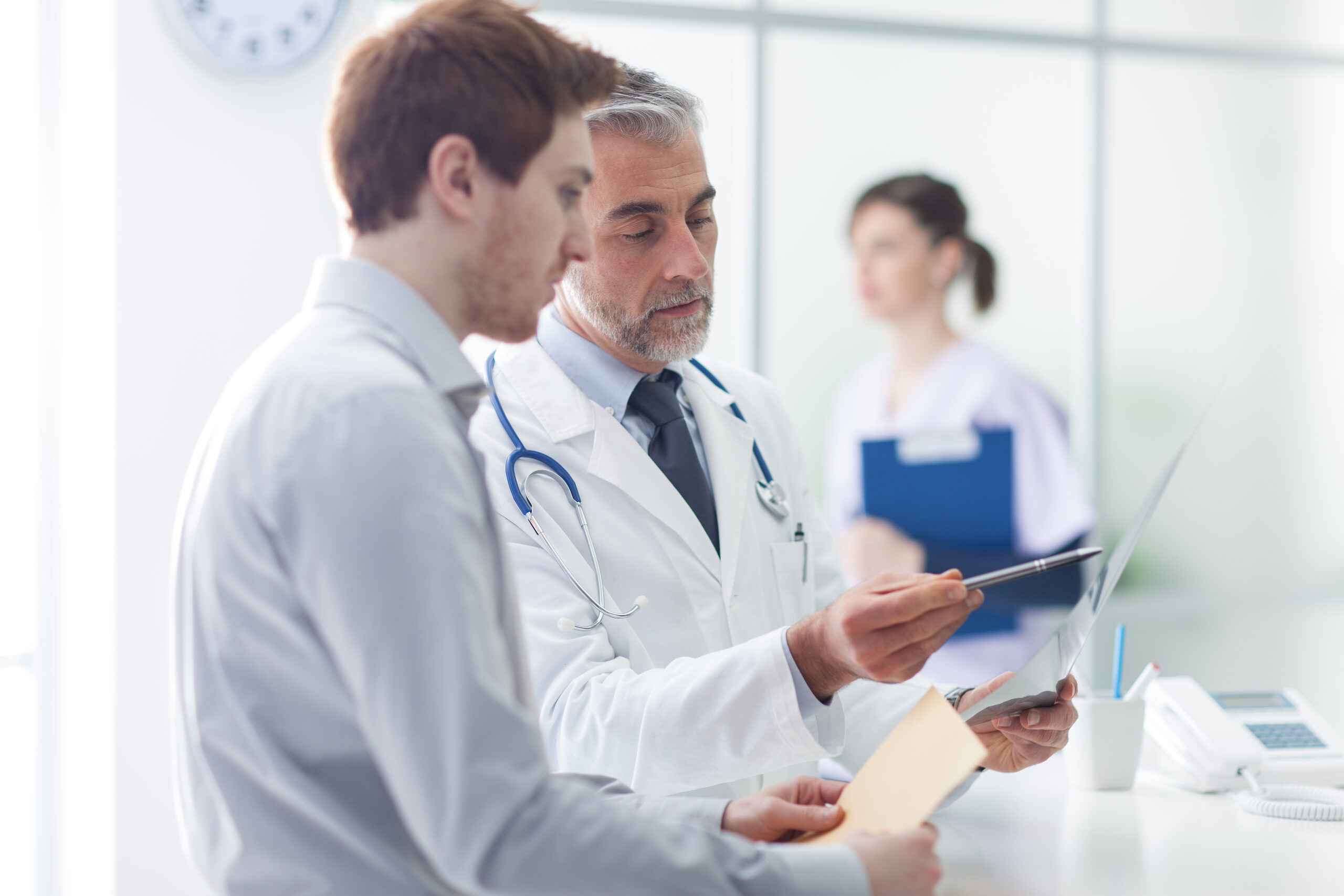 Doctor examining a patient's x-ray